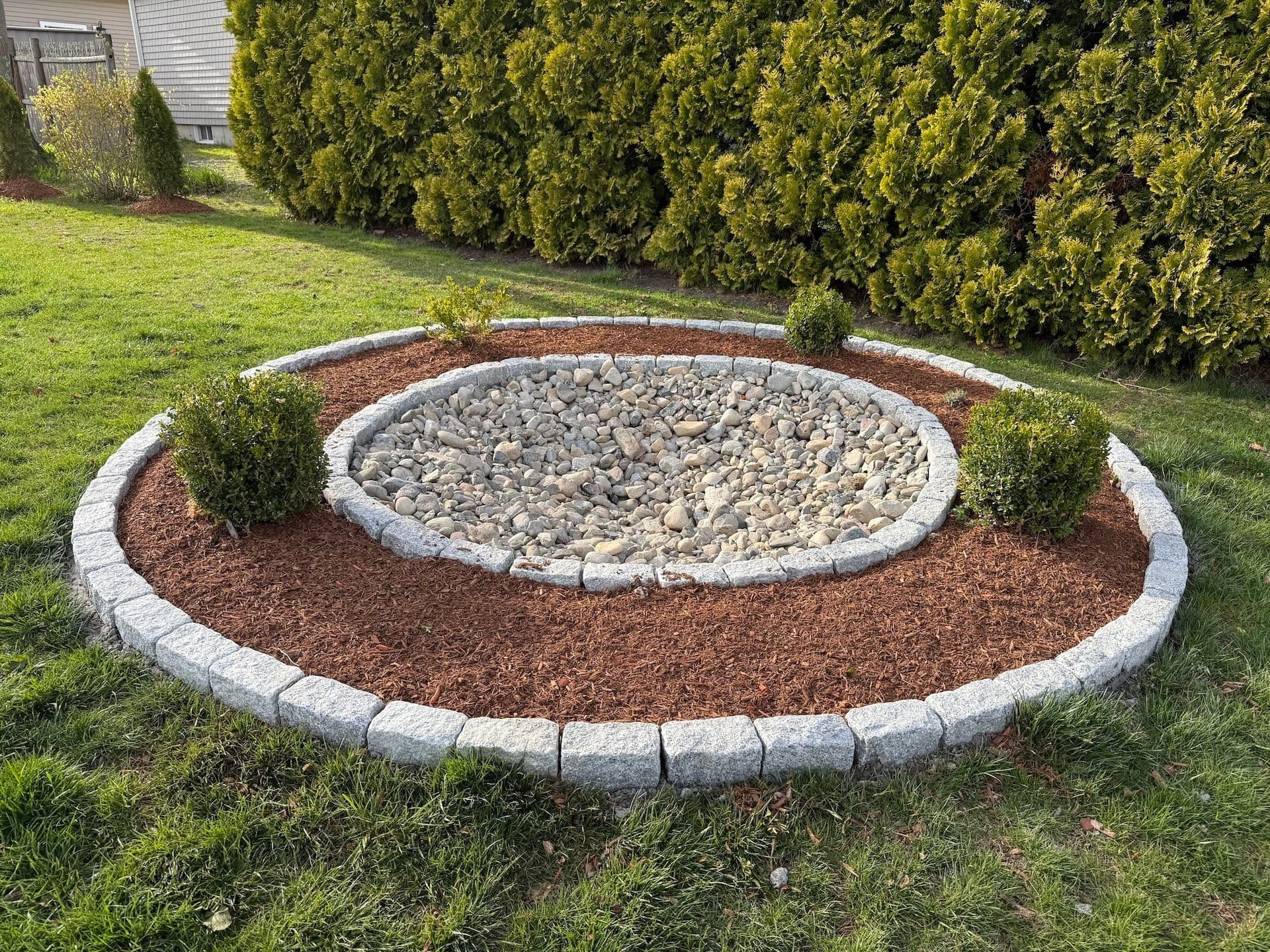 A LawnCheck-maintained East Bay home with a healthy, freshly cut lawn and tidy beds